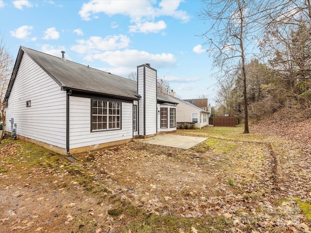 rear view of property featuring a patio