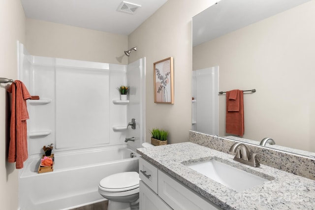 full bathroom with wood-type flooring, vanity, bathing tub / shower combination, and toilet