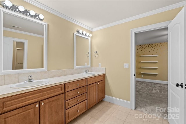 bathroom featuring tile patterned floors, vanity, and ornamental molding