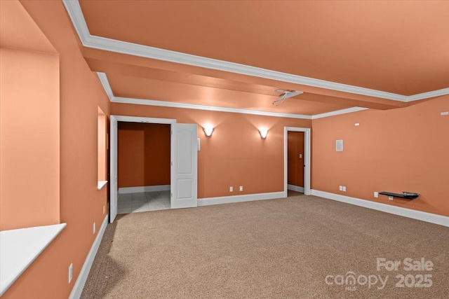 carpeted spare room featuring crown molding