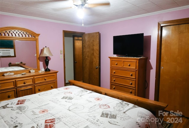 bedroom featuring ceiling fan, cooling unit, and ornamental molding