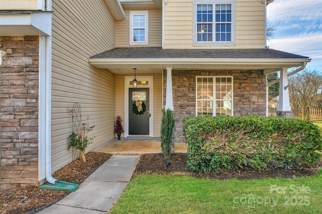 doorway to property with a porch