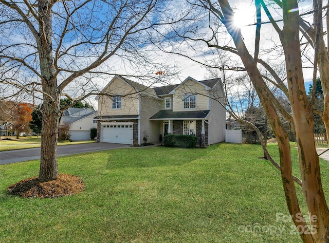 view of front of home featuring a garage and a front yard