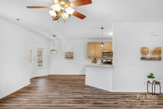 unfurnished living room with ceiling fan, lofted ceiling, and dark hardwood / wood-style flooring