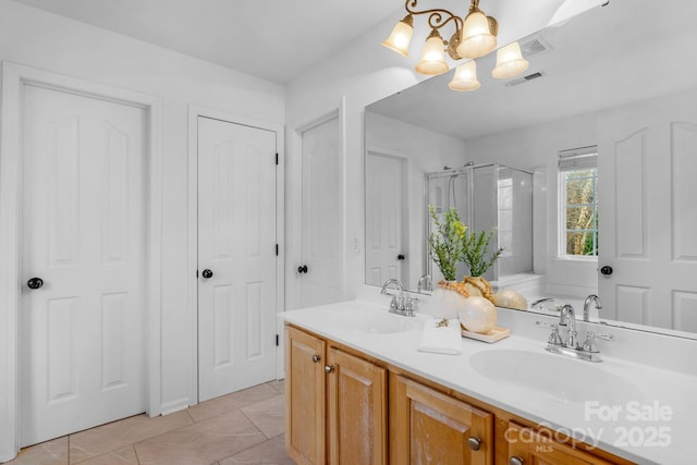 bathroom featuring vanity, independent shower and bath, and tile patterned flooring