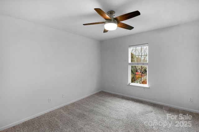 spare room with carpet floors and ceiling fan