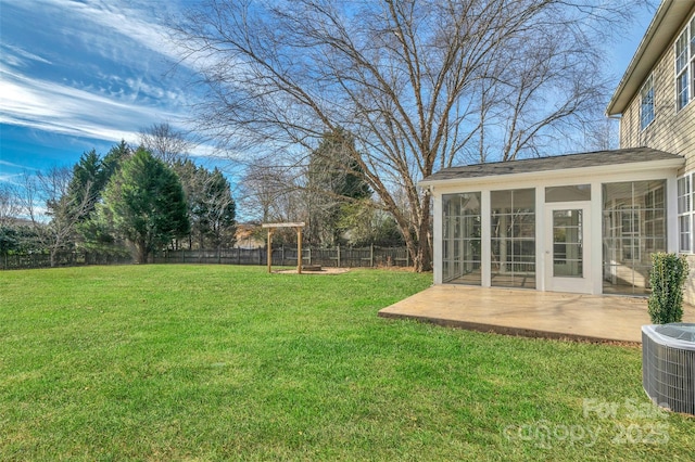 view of yard featuring a patio, a sunroom, and central air condition unit