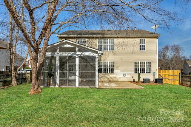 back of property featuring a patio, central air condition unit, a sunroom, and a lawn