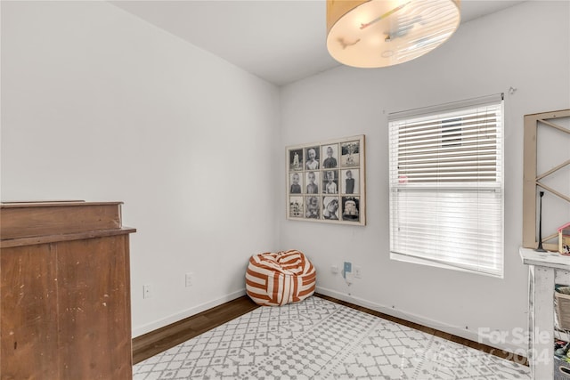 bedroom with dark wood-type flooring