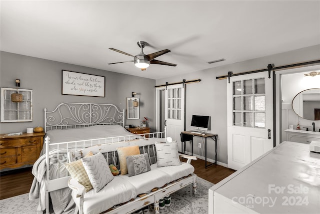 bedroom with ceiling fan and dark wood-type flooring