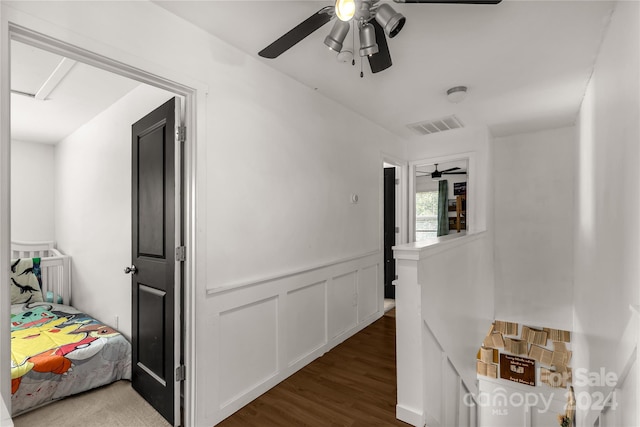 hallway with hardwood / wood-style floors