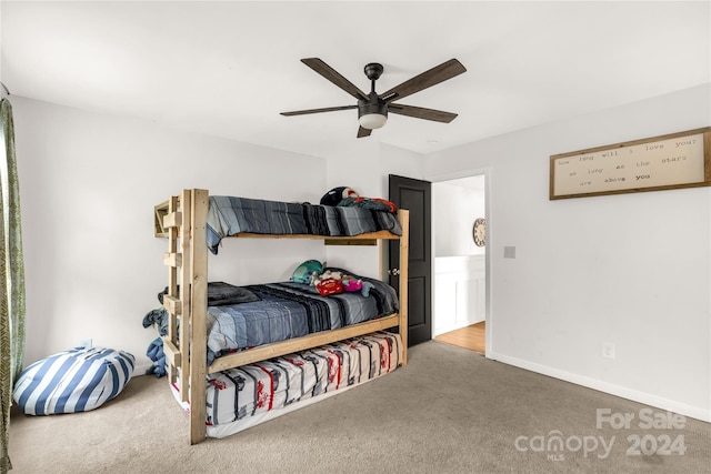 carpeted bedroom featuring ceiling fan