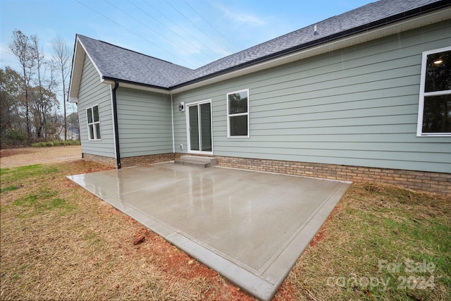 back of property featuring a patio