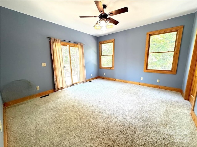 unfurnished bedroom with carpet floors and ceiling fan