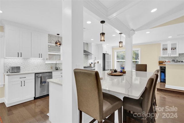 dining space with ornamental molding, sink, beam ceiling, dark hardwood / wood-style floors, and wine cooler