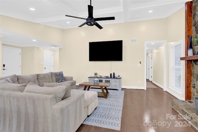 living room with beamed ceiling, dark hardwood / wood-style floors, ceiling fan, and crown molding