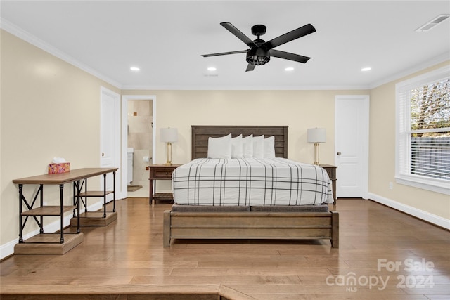 bedroom with ceiling fan, wood-type flooring, and crown molding