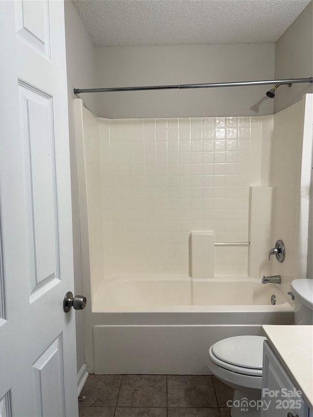 full bathroom featuring tile patterned floors, vanity, a textured ceiling, and bathtub / shower combination