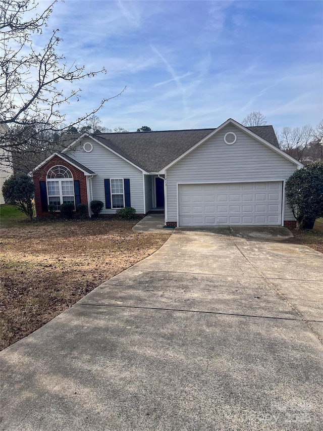 single story home featuring a garage