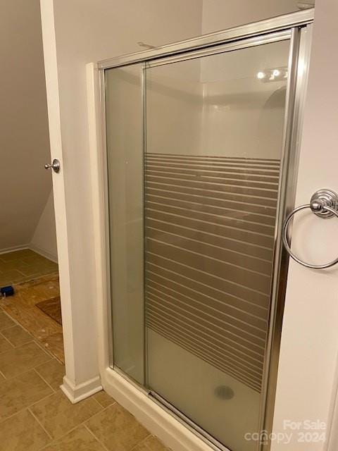 bathroom featuring tile patterned flooring and walk in shower