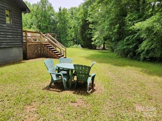 view of yard with a wooden deck