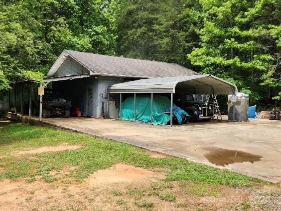 view of vehicle parking with a carport