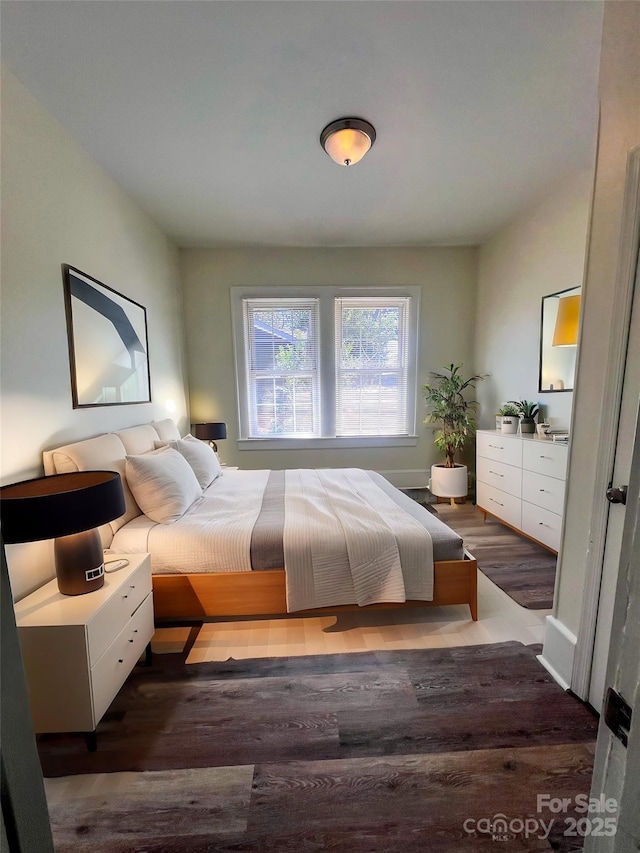 bedroom featuring wood finished floors