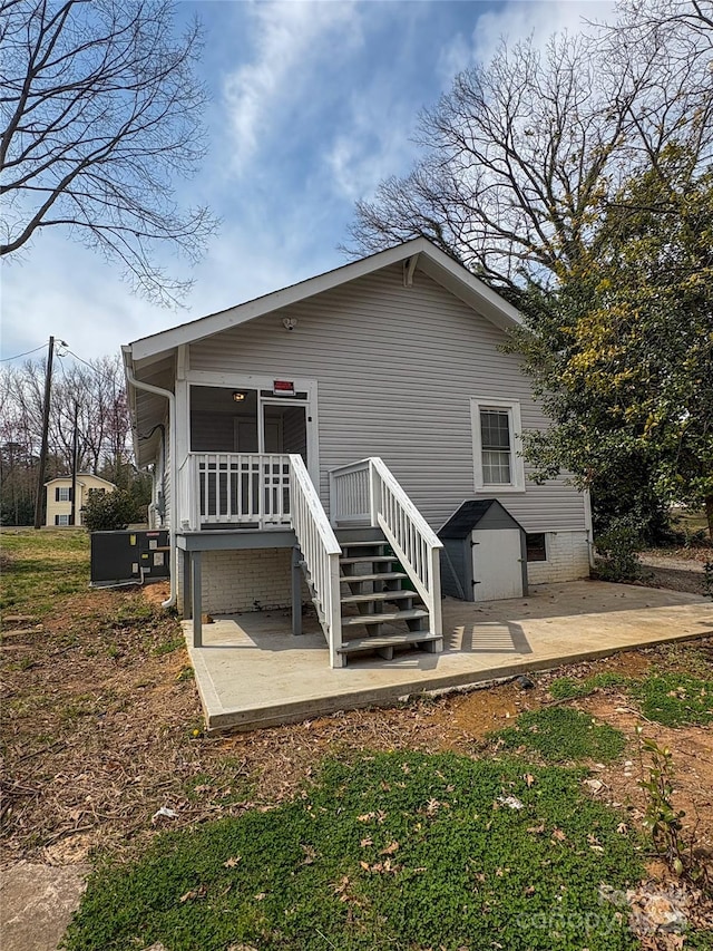 back of property with a patio