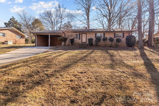 ranch-style home featuring central AC, a front lawn, concrete driveway, and brick siding