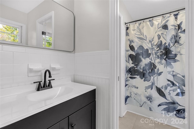 bathroom with tile patterned flooring and vanity