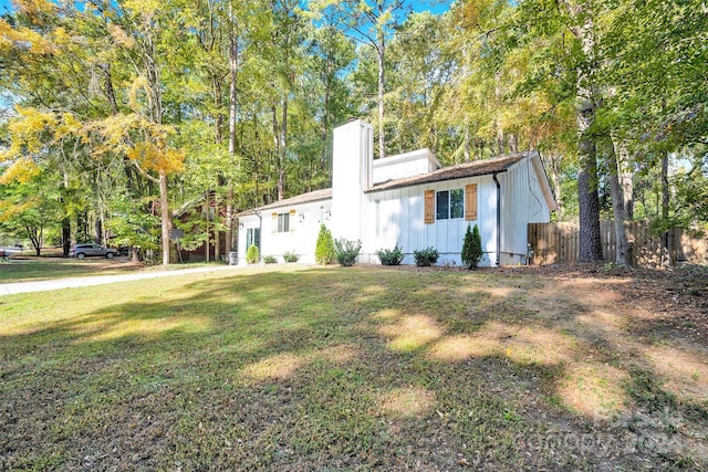 view of property exterior with a lawn