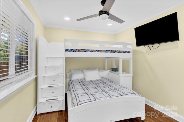 bedroom featuring ceiling fan and dark wood-type flooring