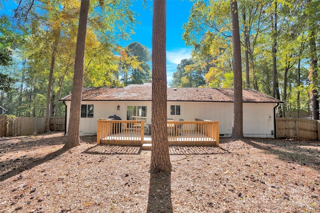 rear view of house with a deck