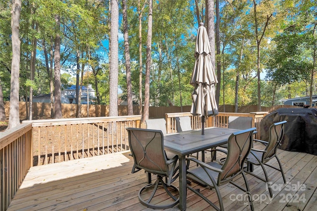 wooden deck with area for grilling