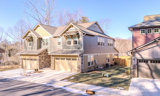 view of front facade with cooling unit and a garage