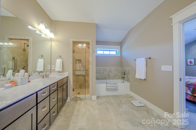 bathroom with separate shower and tub and vanity