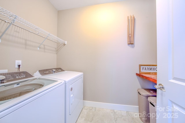 laundry area featuring washing machine and clothes dryer