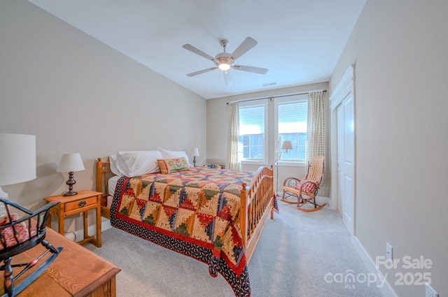 bedroom featuring ceiling fan and light colored carpet