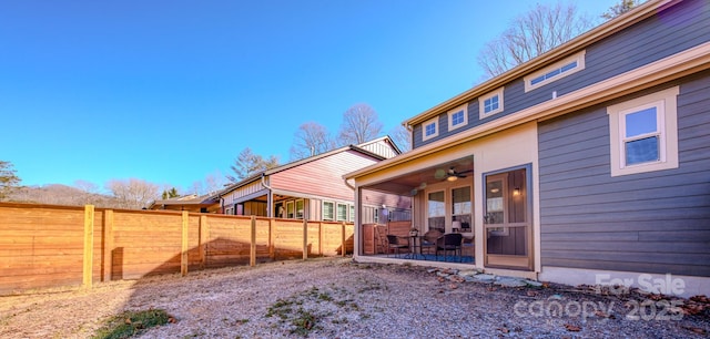 view of yard with ceiling fan