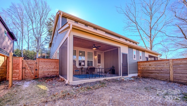 view of front of house with ceiling fan and a patio area