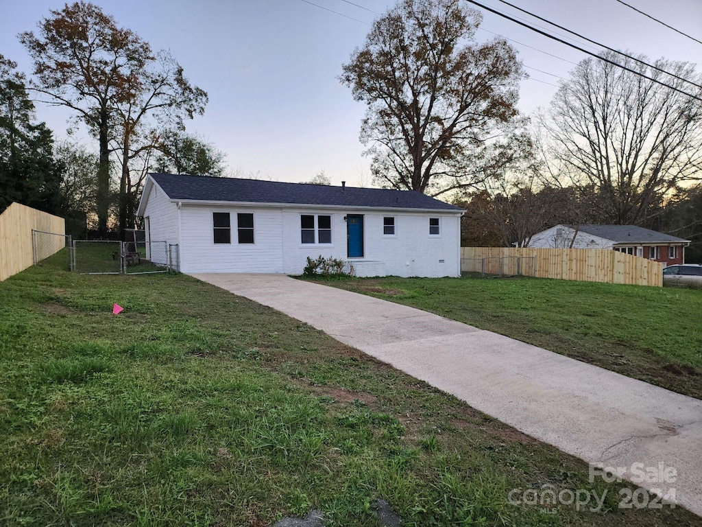 view of front of house with a lawn