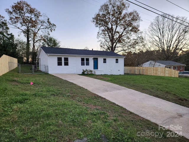 view of front of house with a lawn