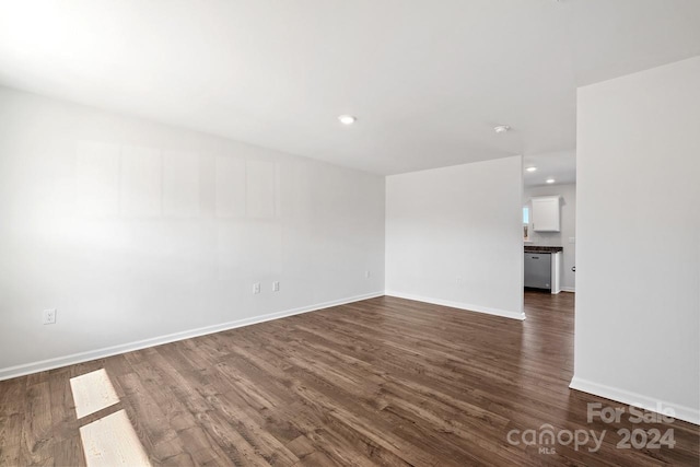 unfurnished room featuring dark hardwood / wood-style floors