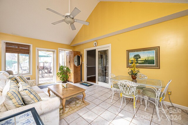 living room with ceiling fan, light tile patterned flooring, and high vaulted ceiling