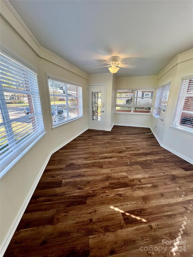 interior space featuring ceiling fan and dark hardwood / wood-style flooring