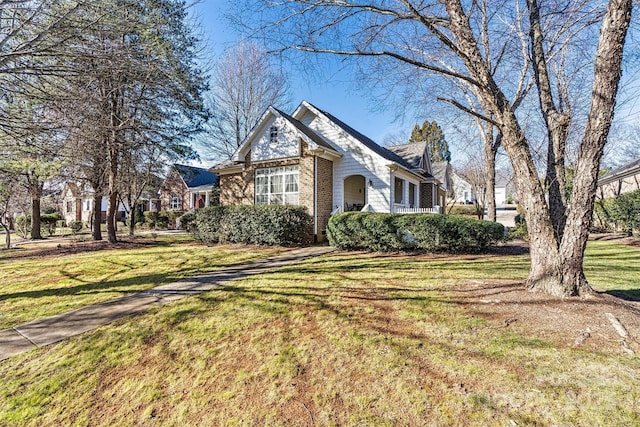 view of side of home featuring a yard