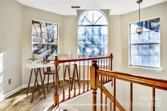 stairs featuring hardwood / wood-style floors