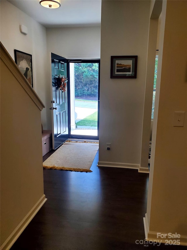 entrance foyer with wood finished floors and baseboards