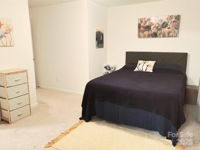 carpeted bedroom with baseboards