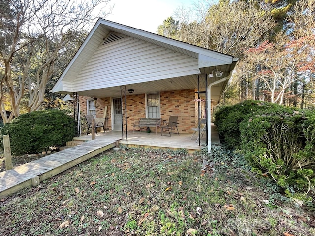 back of house with a porch